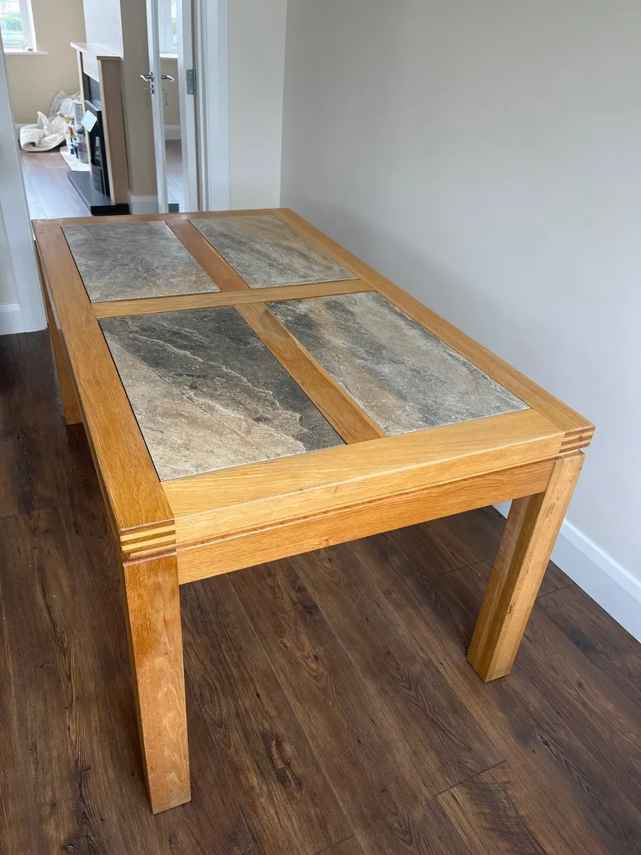 Solid oak dining table and six chairs - Image 1
