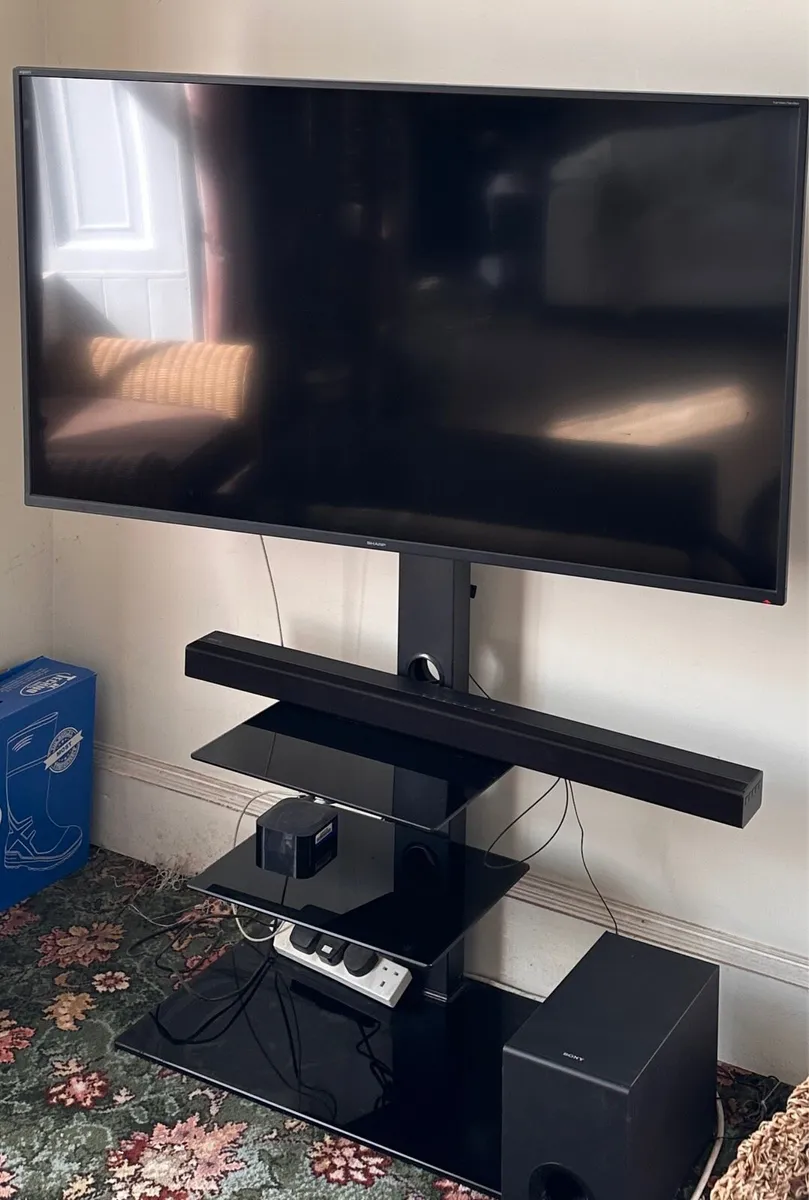 SHARP 50” smart TV, floor TV stand, SONY sound bar - Image 1