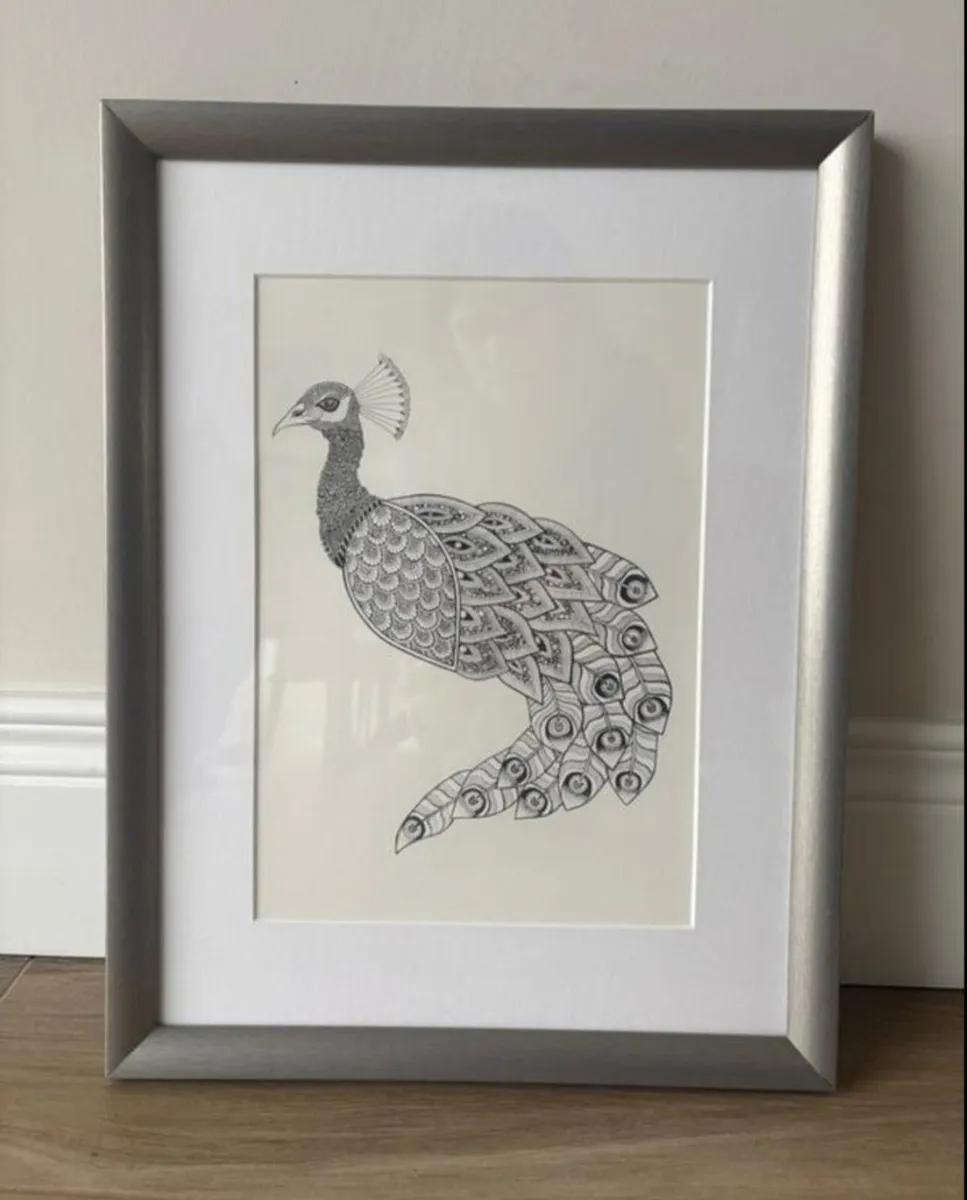 Peacock print in frame
