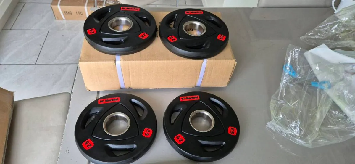 Brand new 4x2.5kilo olympic weight plates - Image 2
