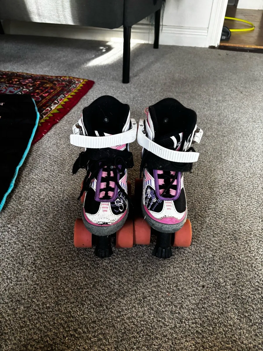 Kids roller skates and helmet - Image 1