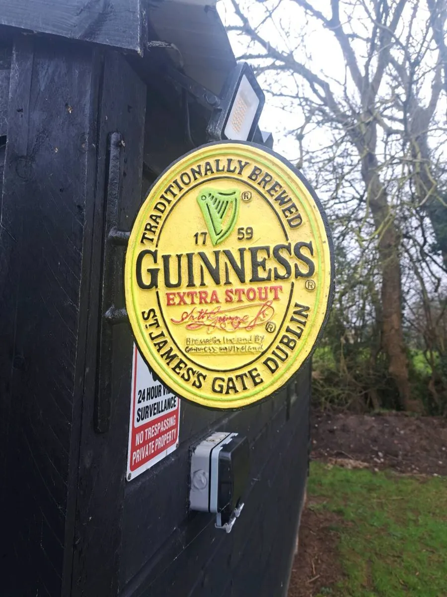 Guinness  2 sided cast iron sign - Image 1
