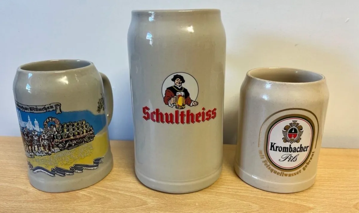 Three vintage stoneware beer steins