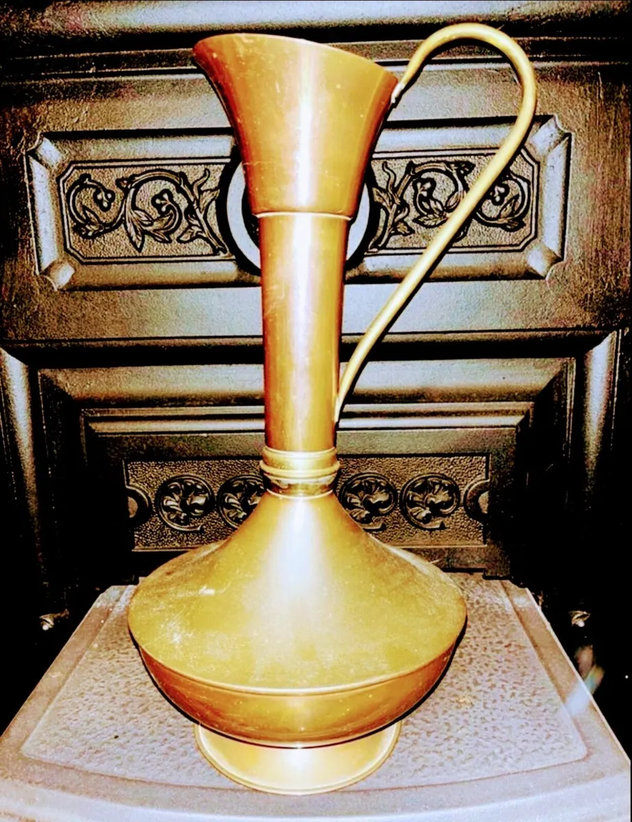 Tall brass and copper water jug