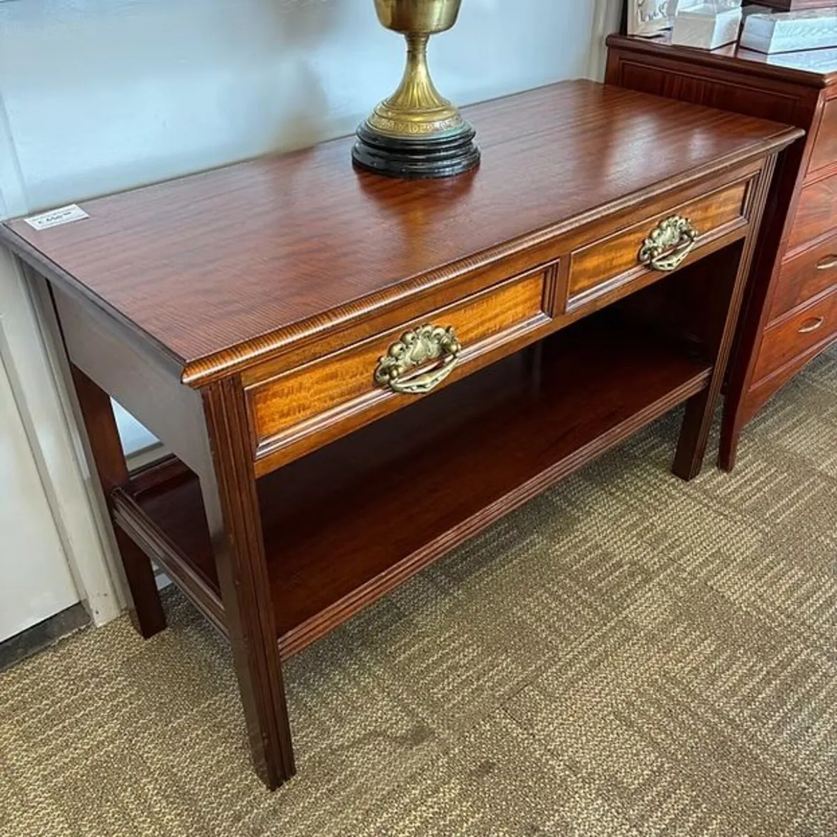 Fabulous two tier mahogany console table. Enclosed