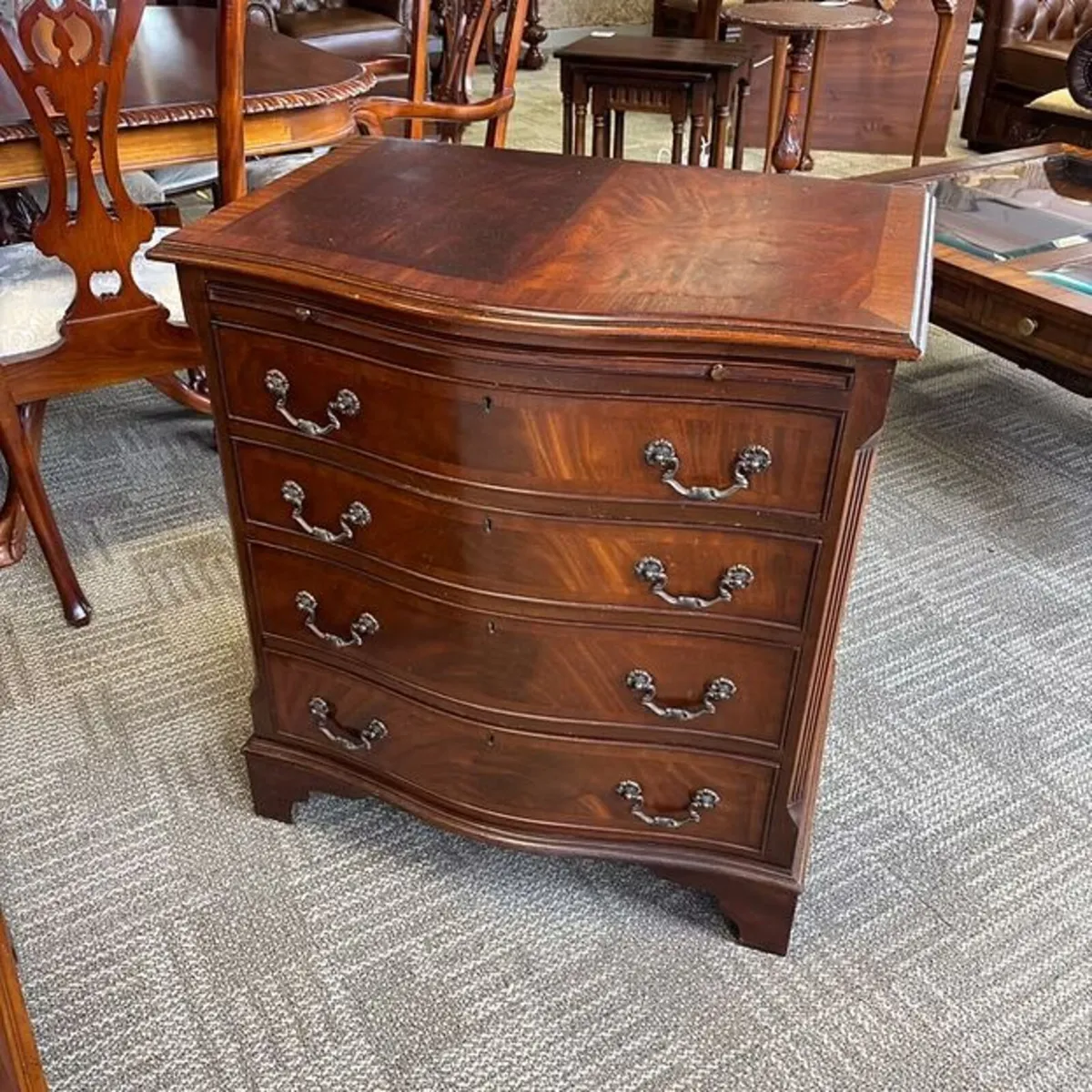 George III style mahogany serpentine front bachelo