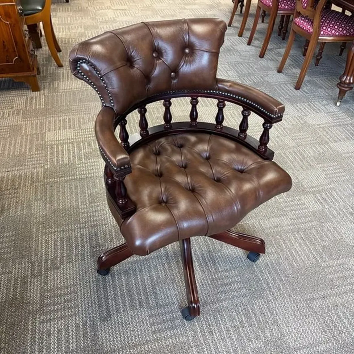 Chesterfield button back swivel leather captains