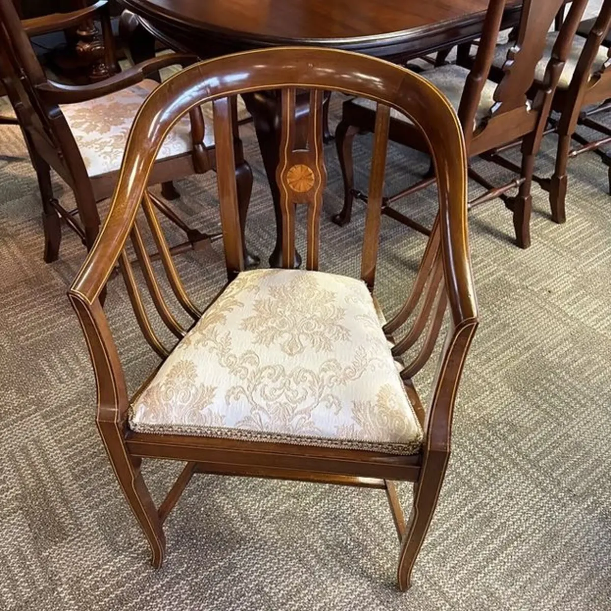 Edwardian-style mahogany bow backed armchair