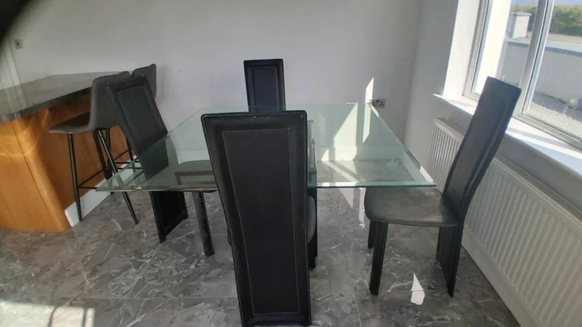 Modern glass table with marble base and 4 chairs - Image 1