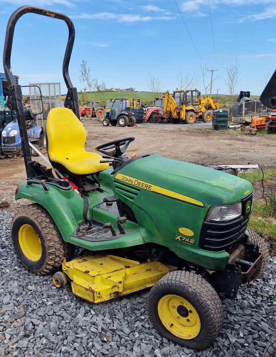 John Deere X748 4wd ride on mower lawnmower - Image 1