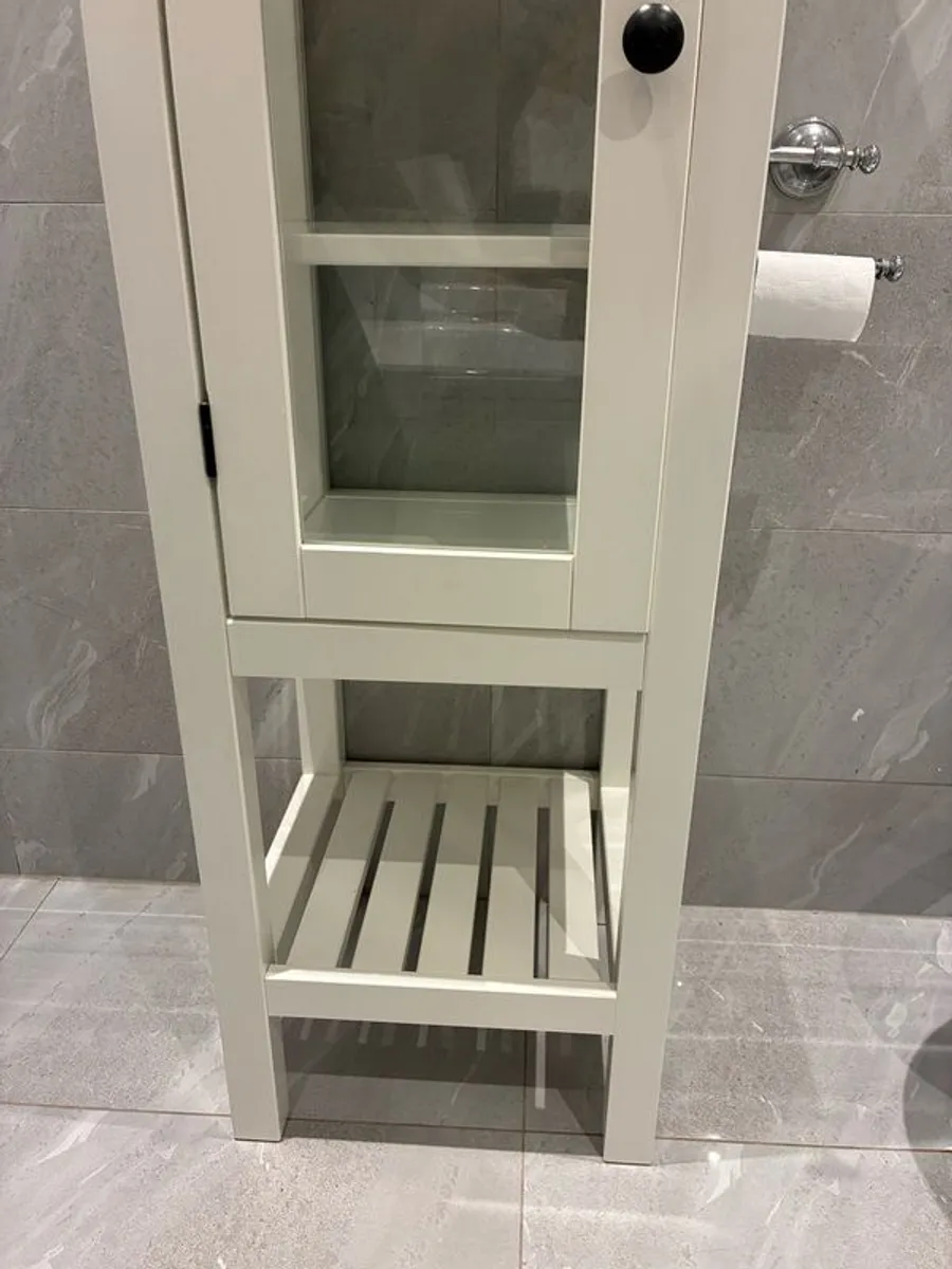 Tall white wooden & glass door storage cabinet with shelving. - Image 1