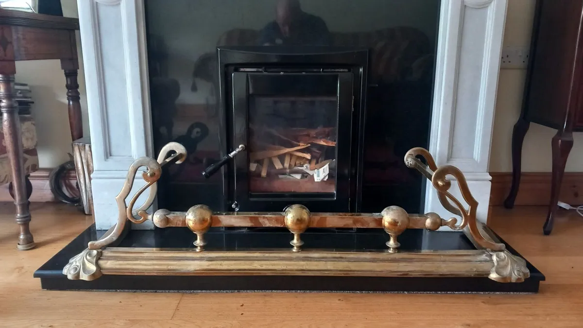 Antique brass fireplace fender