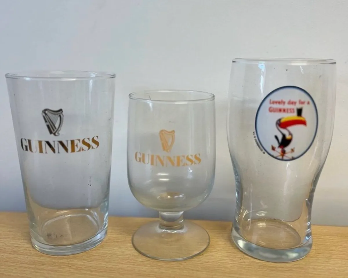Three vintage Guinness glasses