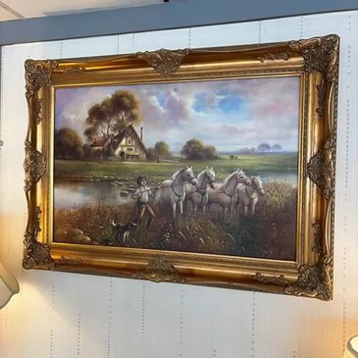 Rural scene, young boy guiding white horses alongs