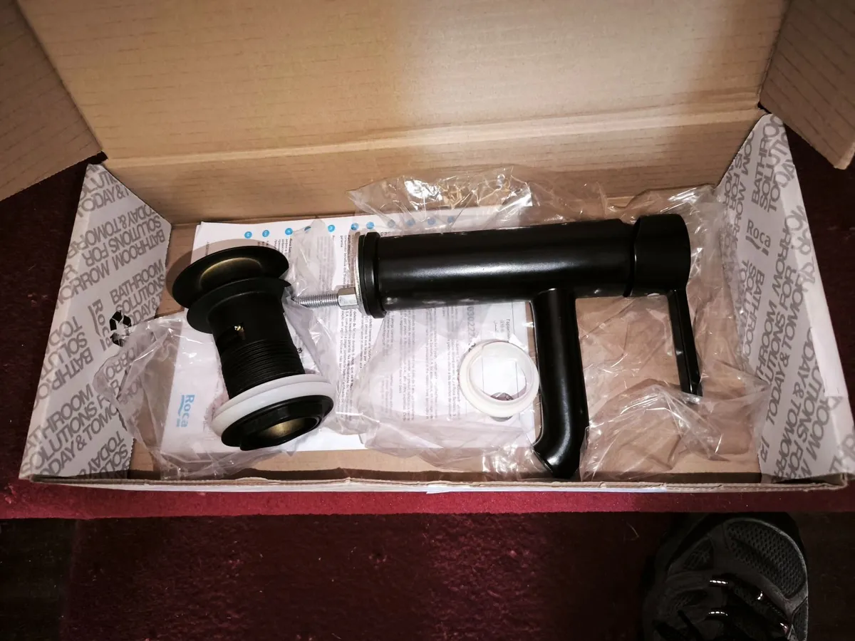 Black Bathroom sink mixer tap and outlet