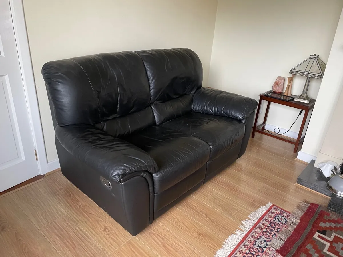 2 seater leather couch with a recliner mechanism - Image 1