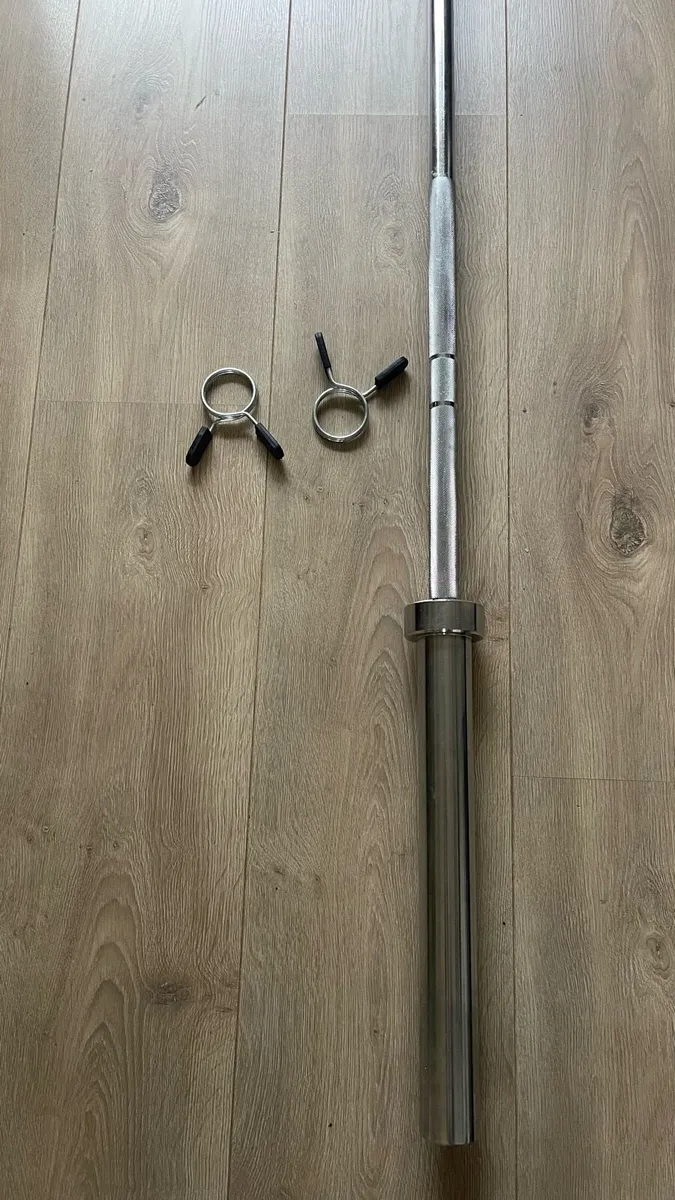 Olympic bar + 2x10 + 2x5 kg weights - Image 1