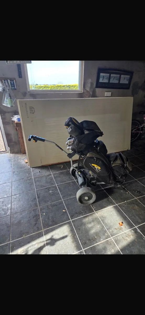 golf clubs and power caddy