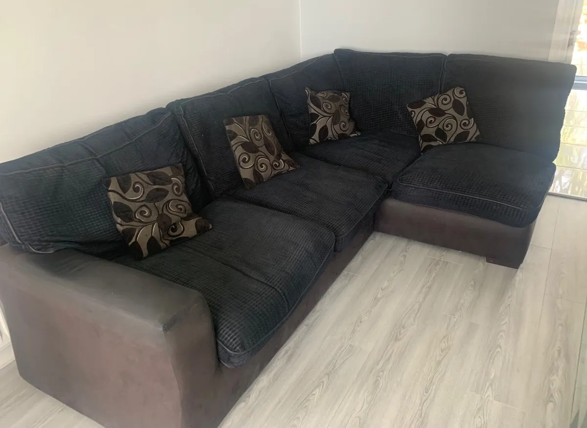 Dark sofa  and swivel chair and matching footstool - Image 1