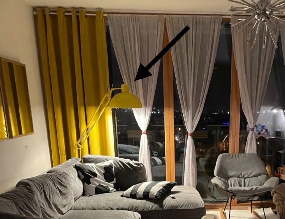 Yellow standing lamp inc curtains