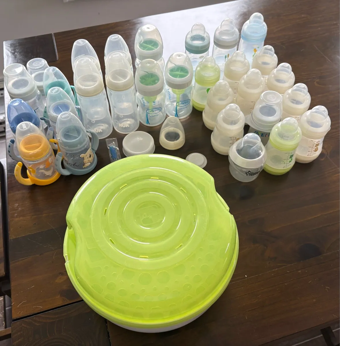 Assortment of Bottles and Mam Bottle Sterilizer - Image 1