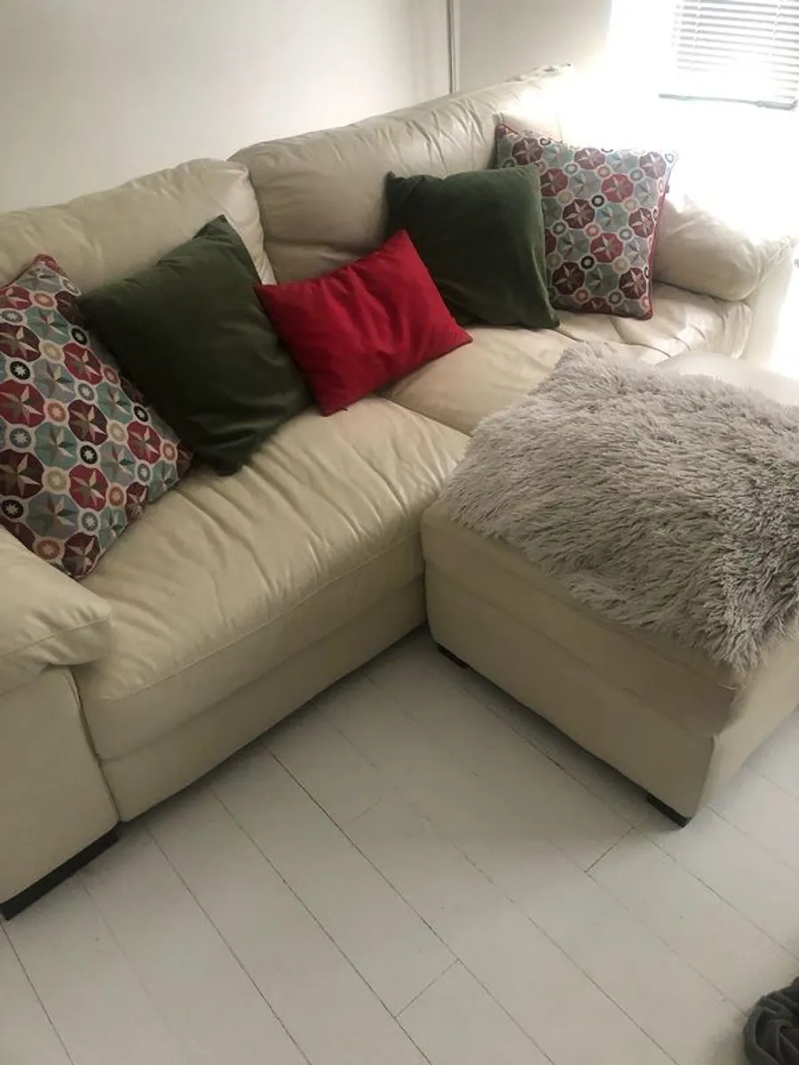 cream leather sofa and footstool/storage box - Image 1
