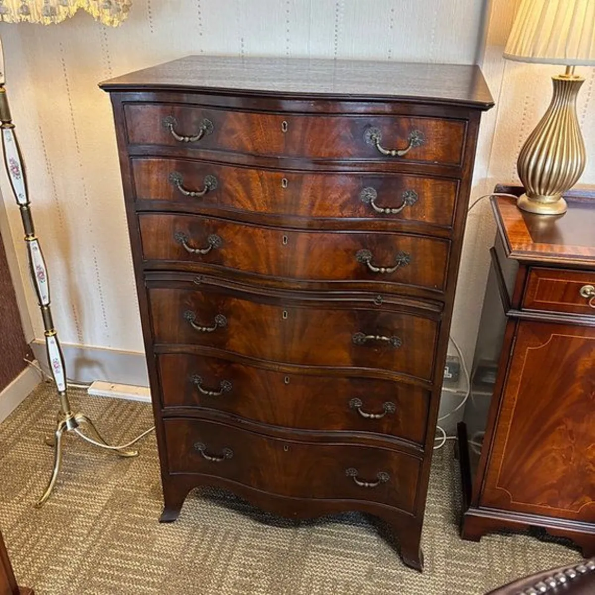 Mahogany serpentine front 6 drawer chest with brus