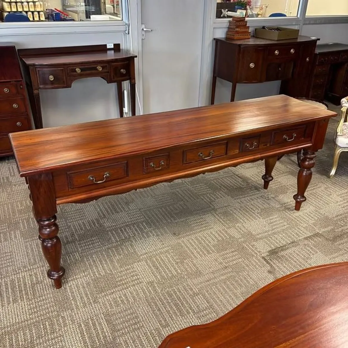 Fabulous mahogany long narrow console table on tur