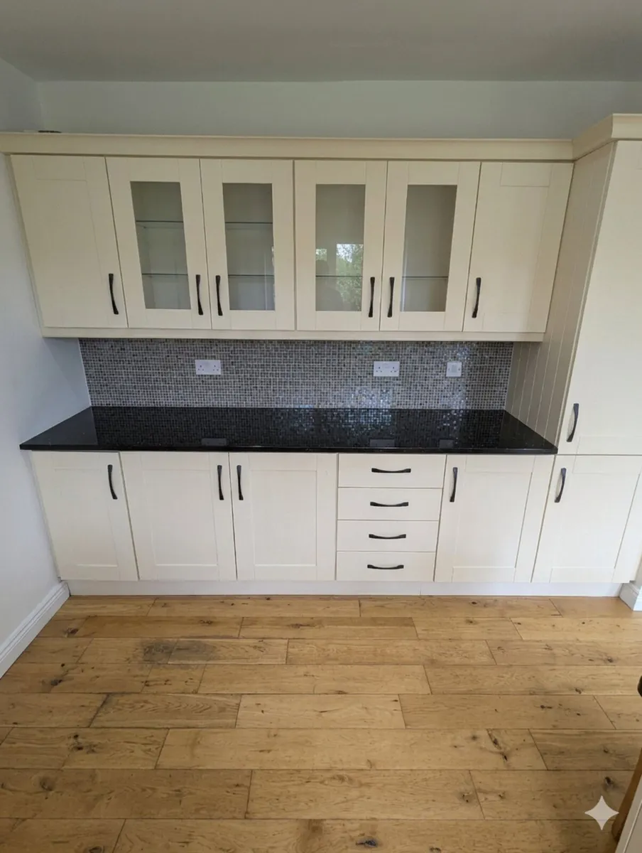 Cream kitchen cabinets & Quartz black countertop - Image 1