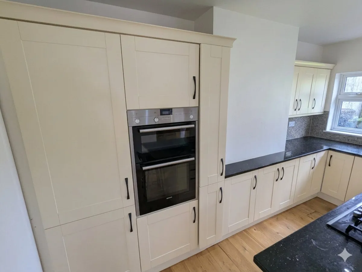 Cream kitchen cabinets & Quartz black countertop - Image 4