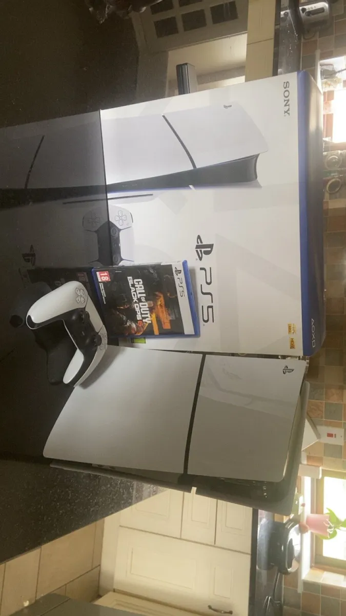 PlayStation 5 with controller and BO6 - Image 1