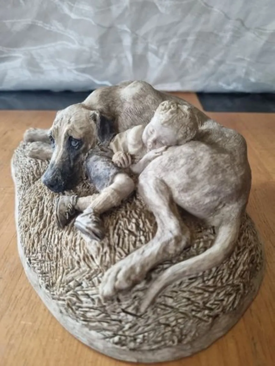 Sculpture of a boy sleeping with a dog - Image 2