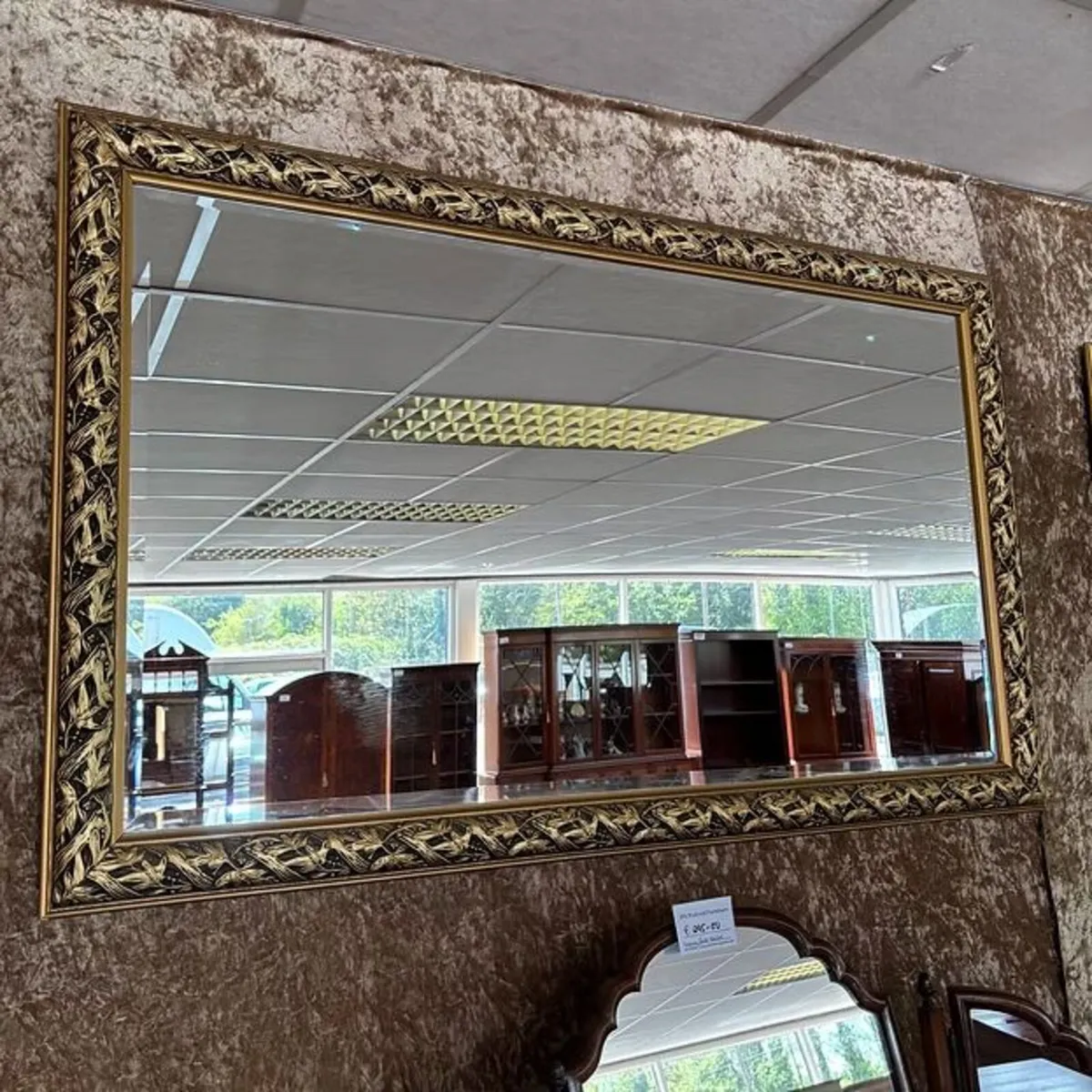 Gilt framed bevel edged mirror