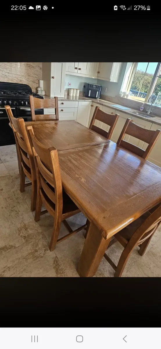 Solid oak table and 6 chairs (Goes bigger)