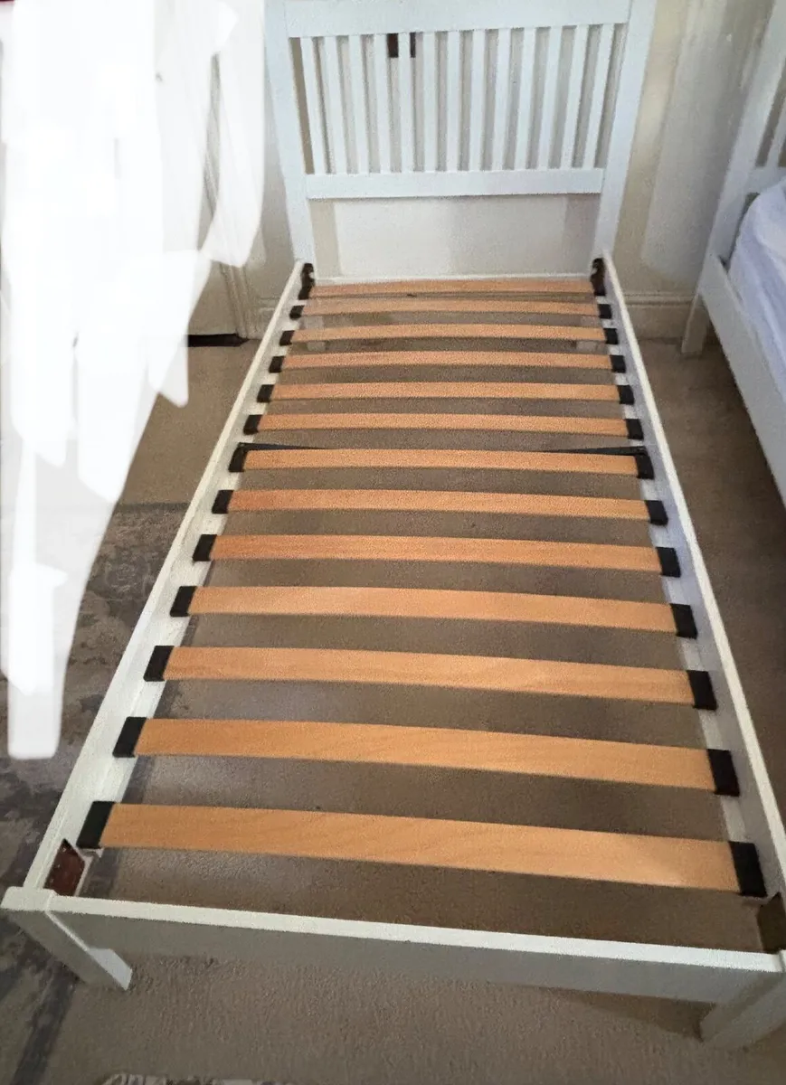 2 white single bed frames