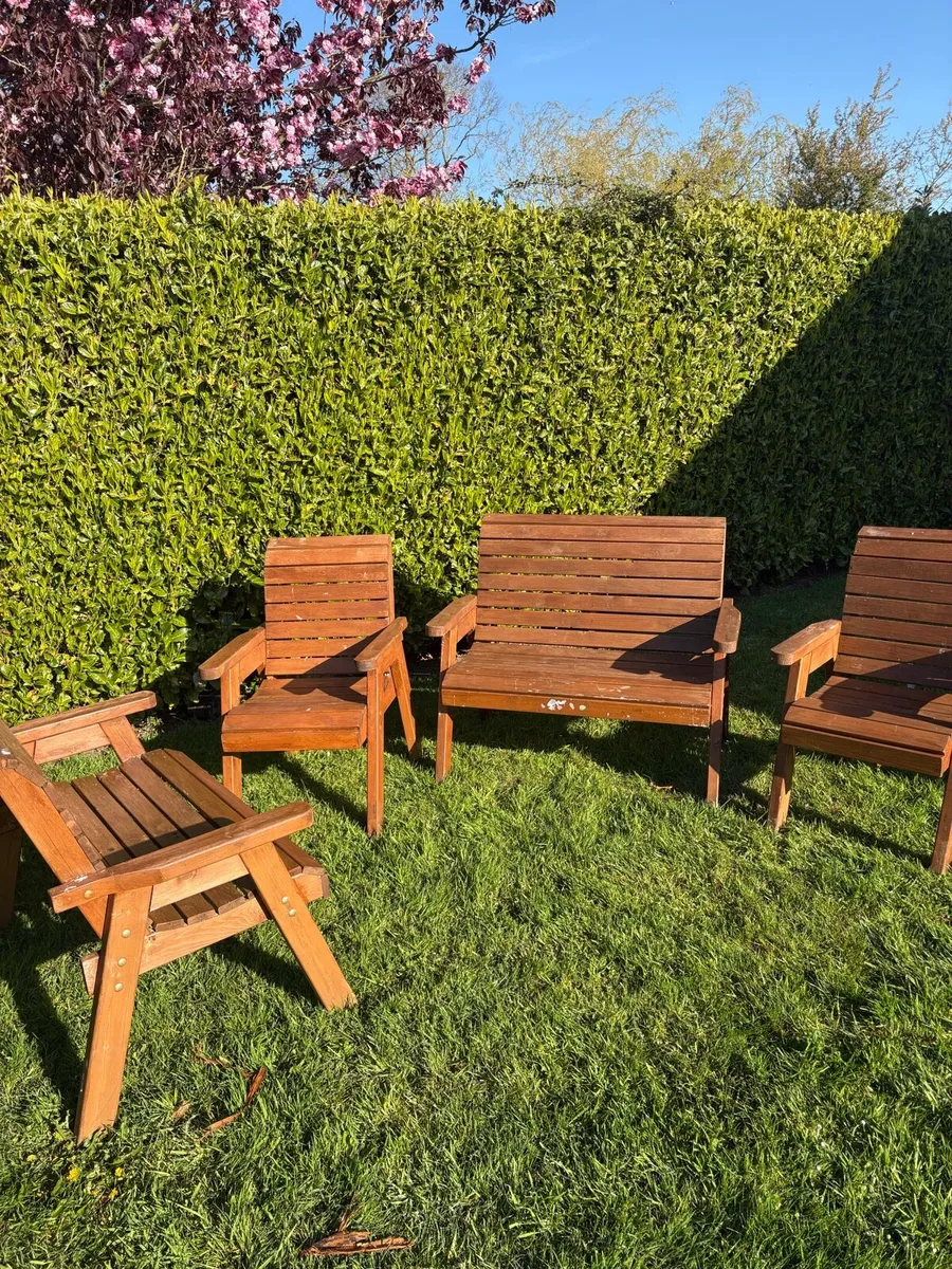Wooden outdoor table and chairs - Image 1