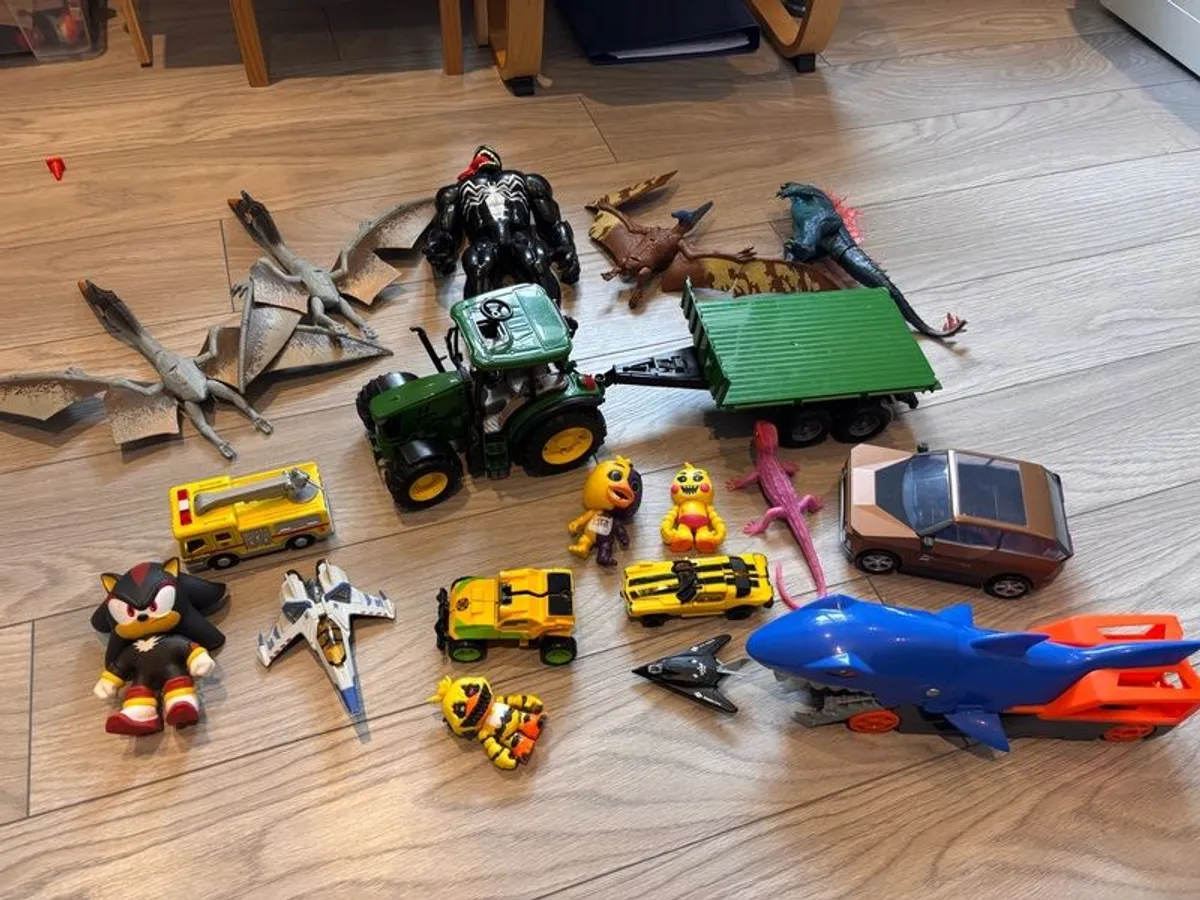 Mixture of toys godzilla, venom, dinosaurus, tracyor - Image 1