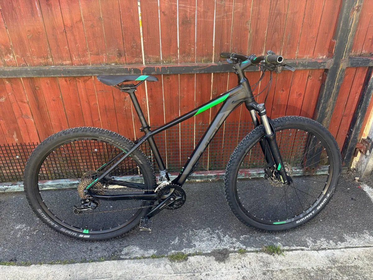 Black/Green cube mountain bike - Image 1