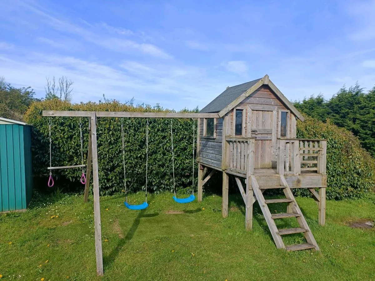 Timber playhouse and swings - Image 2