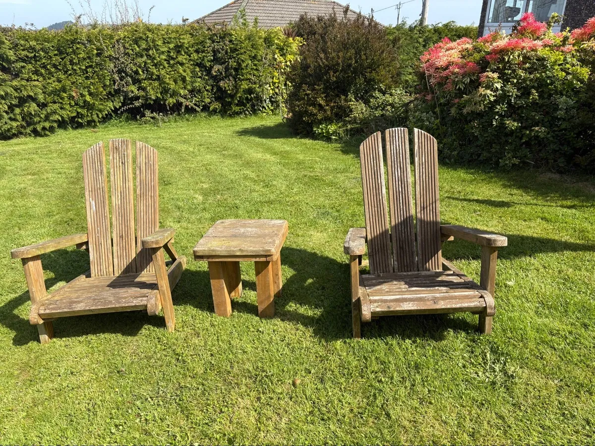 Wood handmade Adirondack chairs and table.