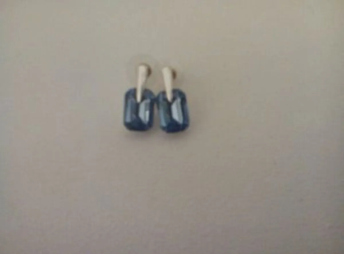 Polished Metal and Blue Stone Set Earrings.