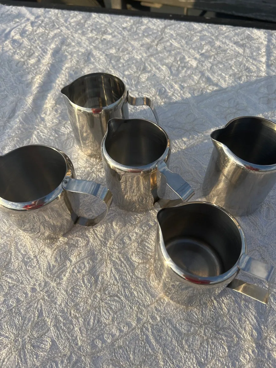 5 stainless steel milk jugs - Image 1