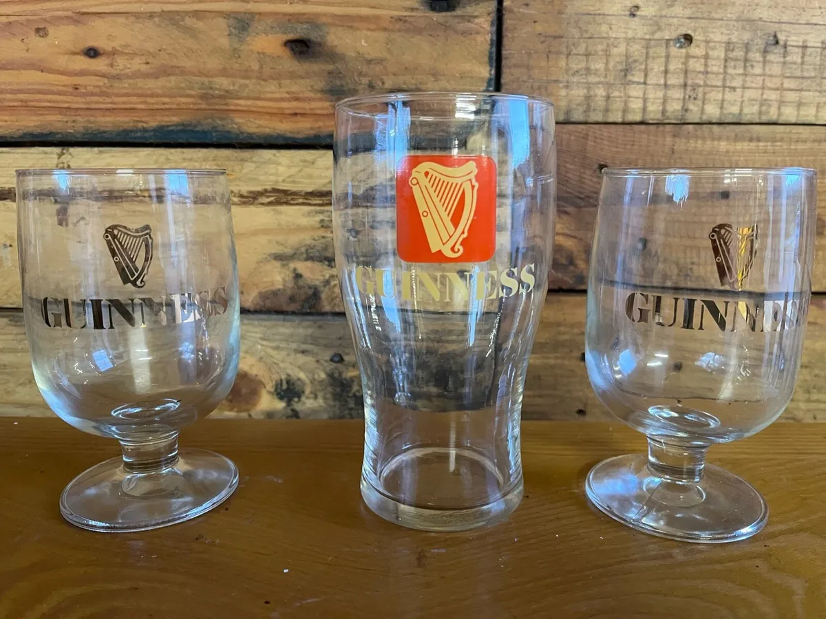 Three vintage Guinness glasses