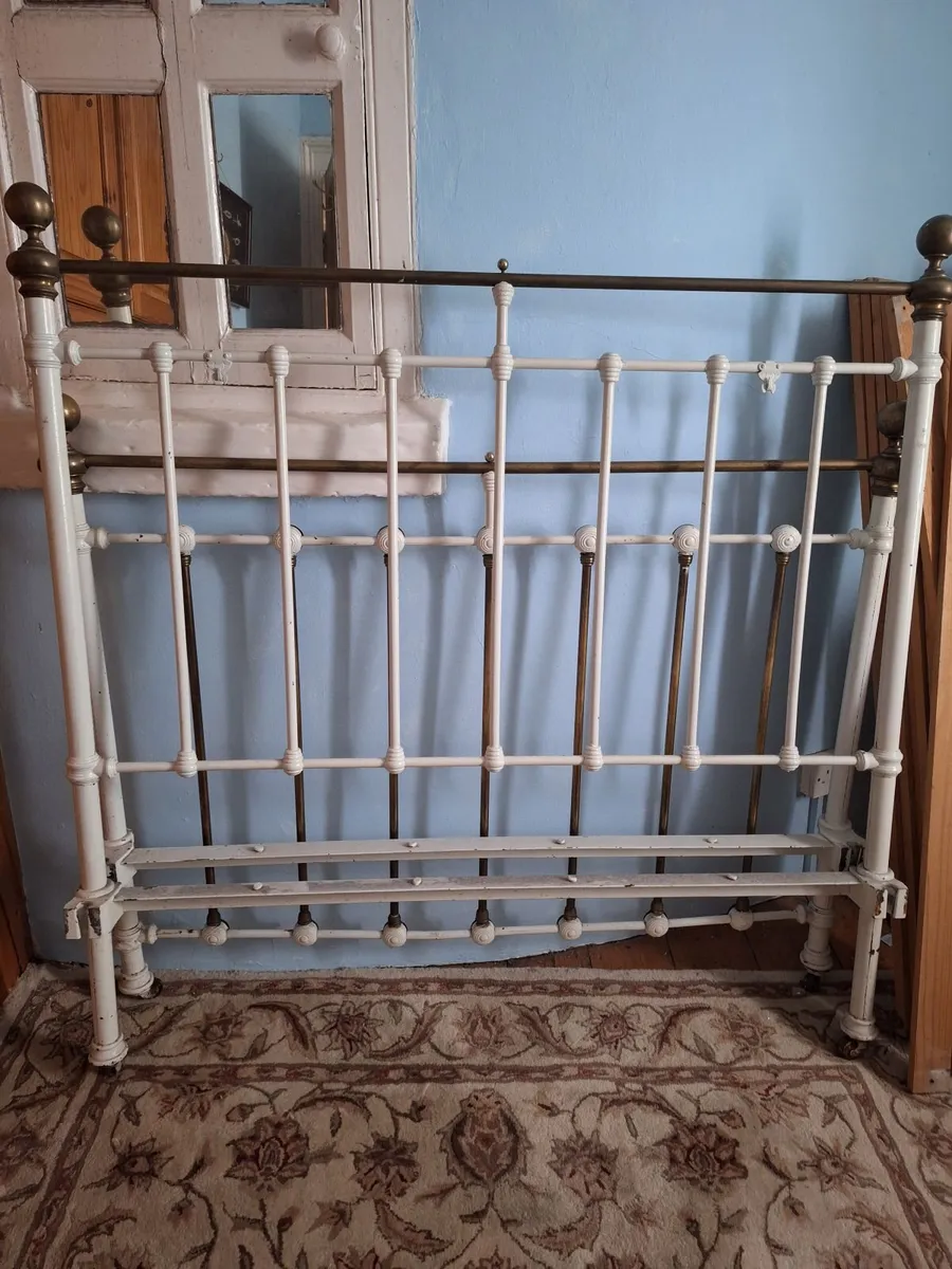 Antique wrought iron headboaed and end....