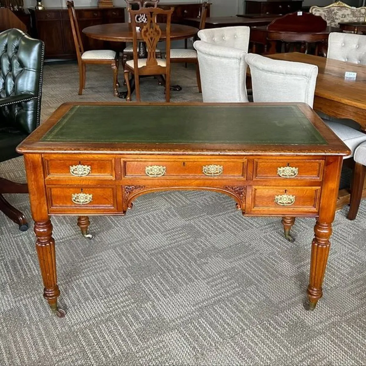 Edwardian oak pedestal writing desk with green lea