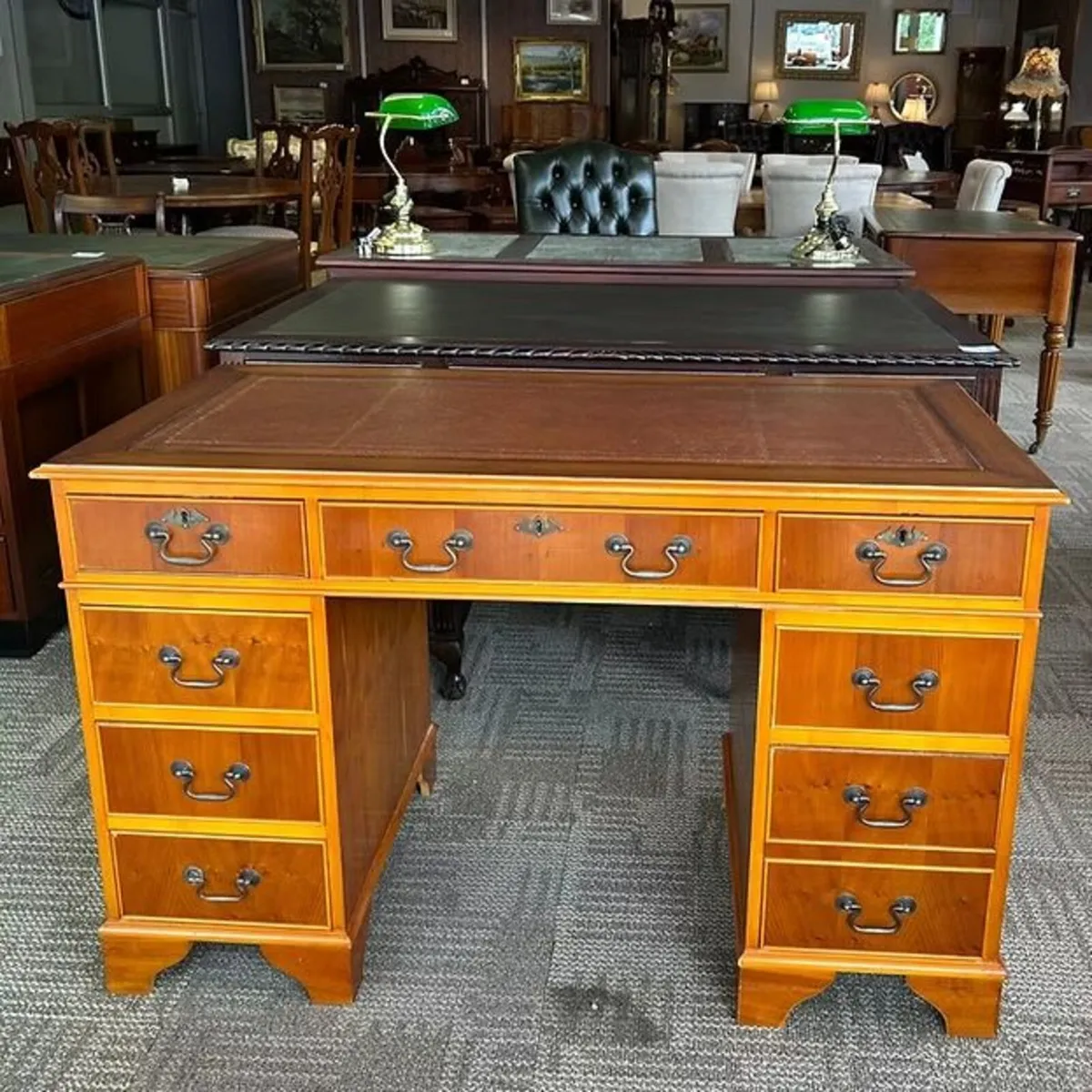 Yew twin pedestal writing desk with tan leather to