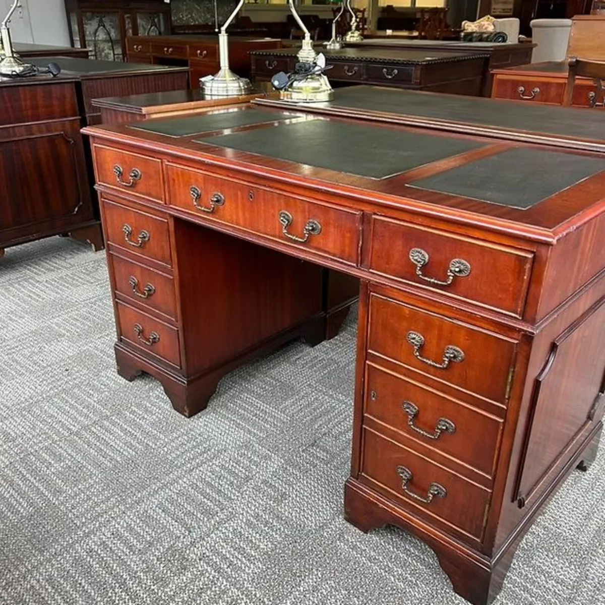 Mahogany twin pedestal writing desk with green lea