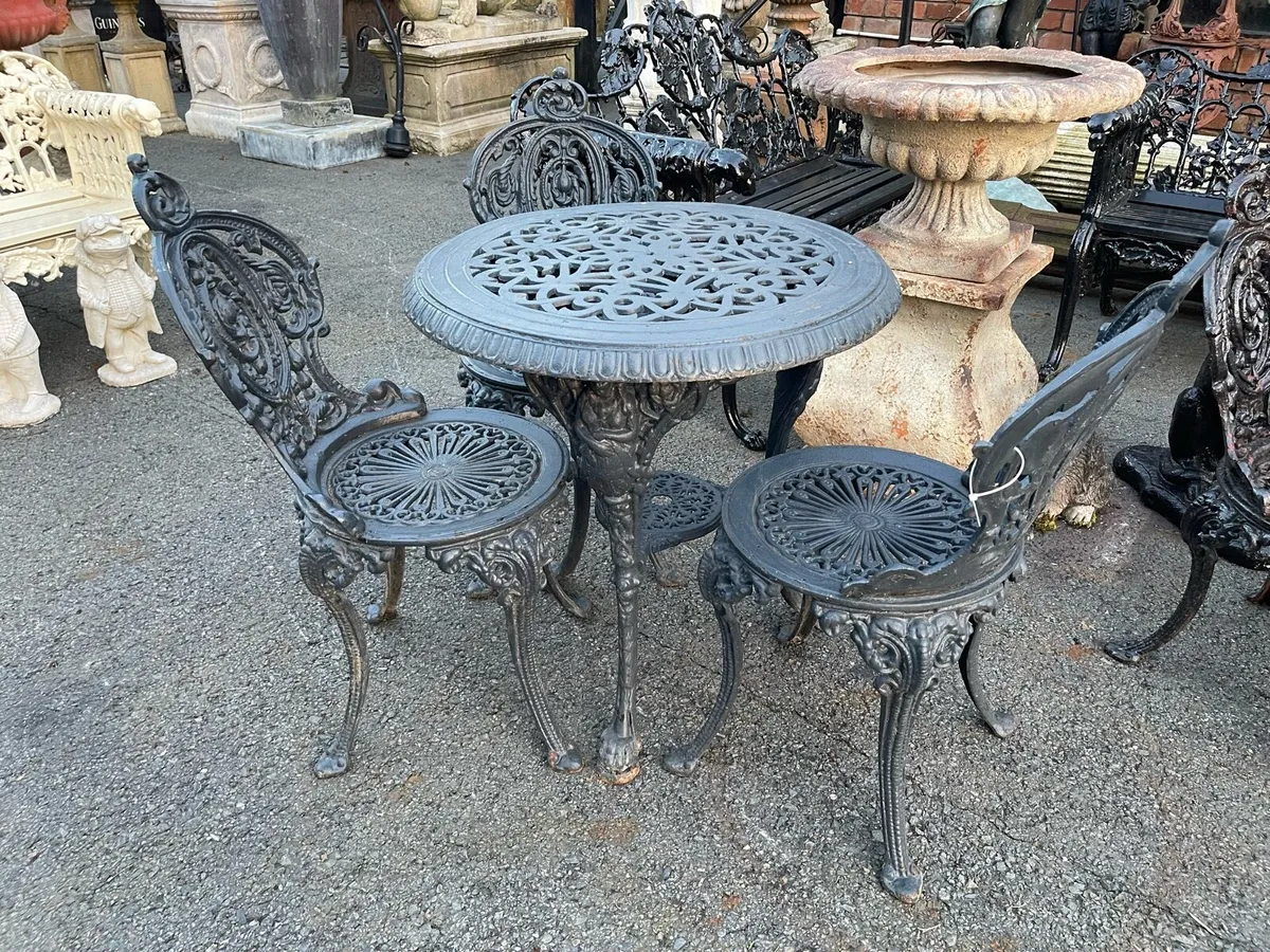 Very heavy cast iron garden table chairs - Image 1