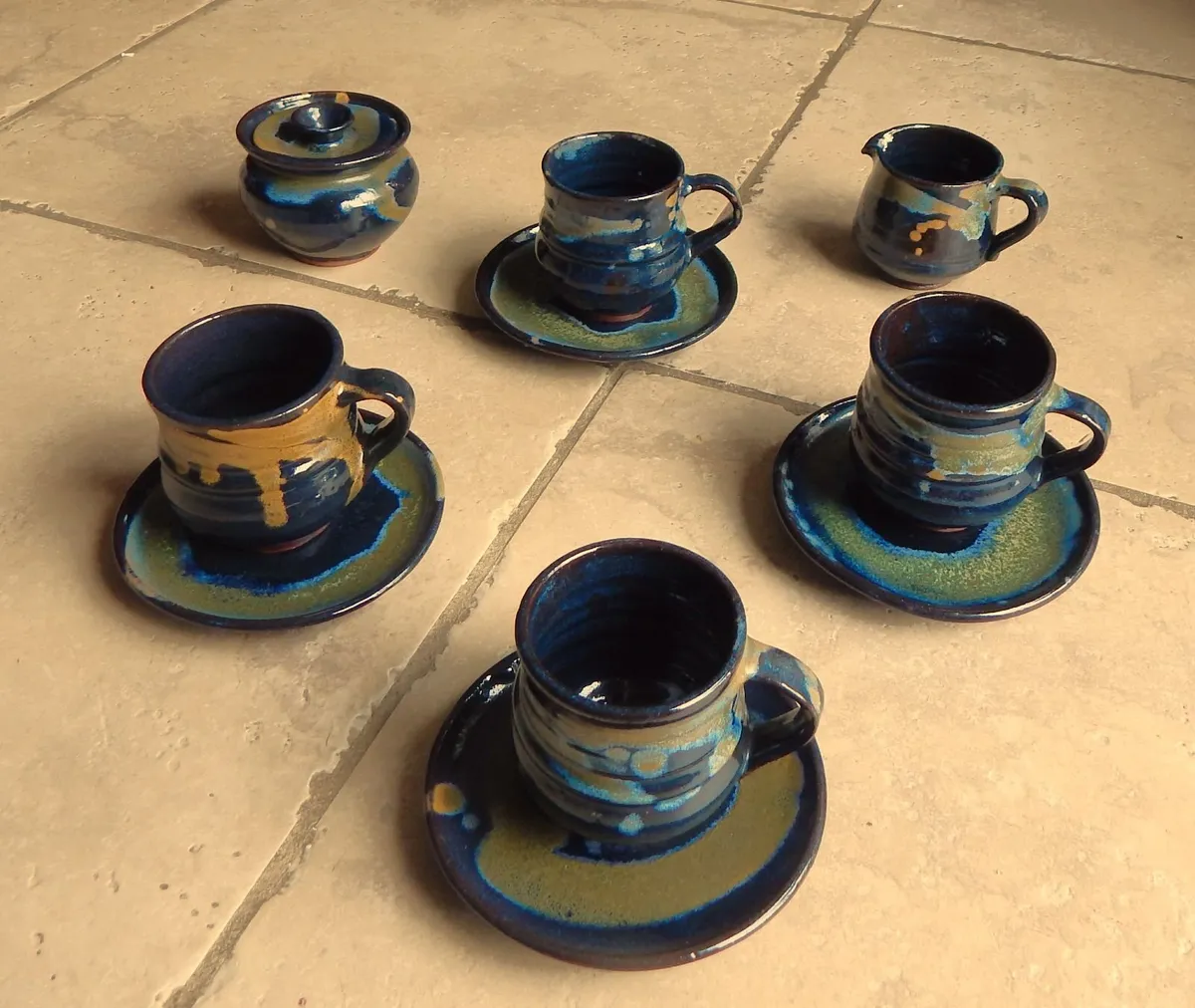 10 Piece Pottery Tea/Coffee Cups & Saucers - Image 1