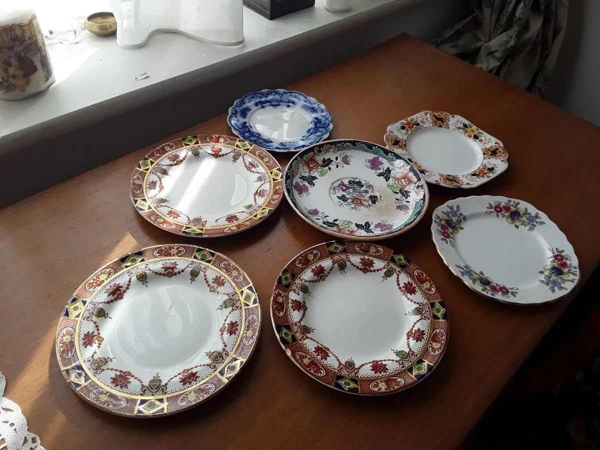 7 odd vintage side plates suitable for matching